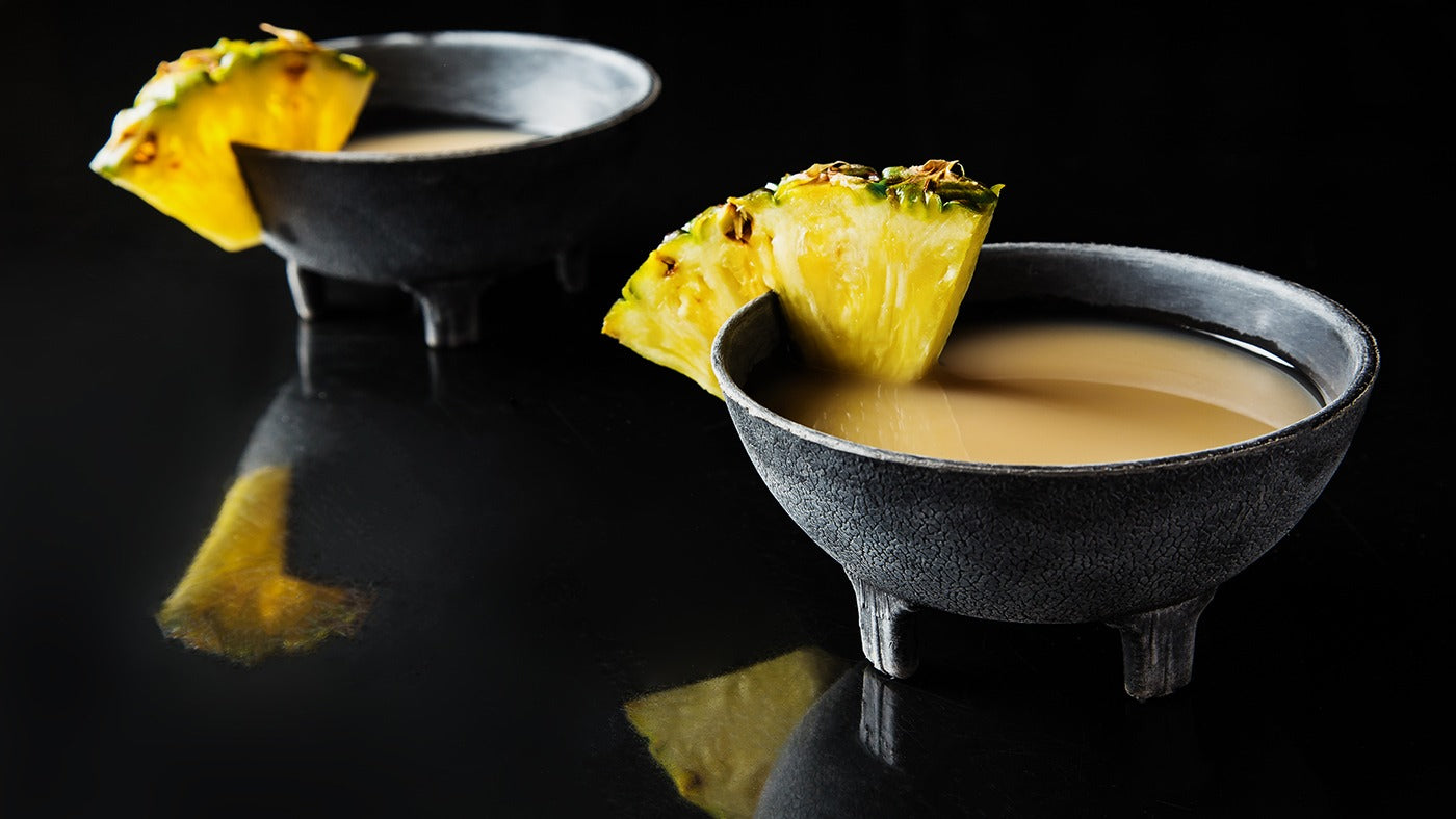 Kava shells garnished with pineapple