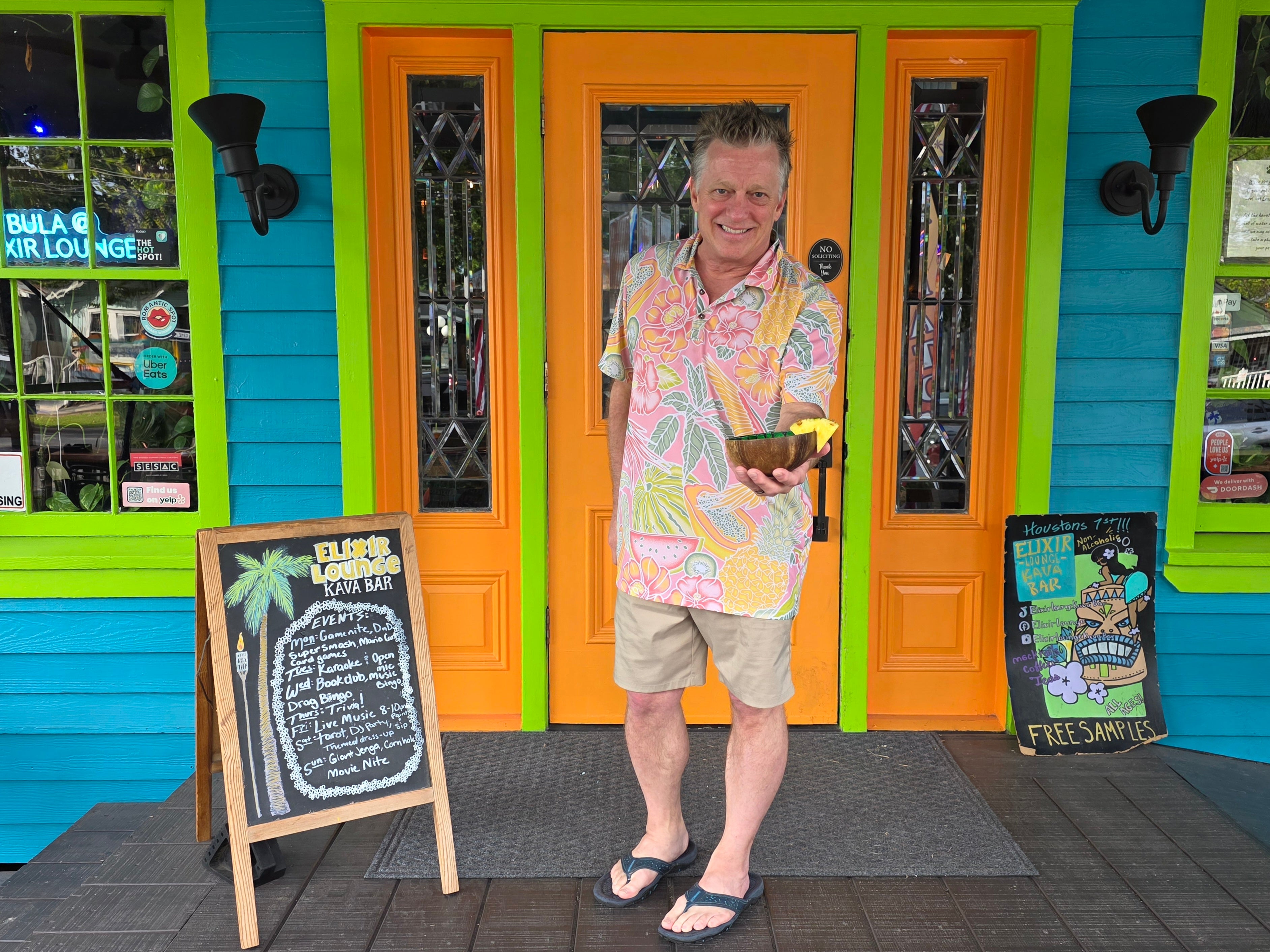 Chris Jepson at the colorful entrance of Elixir Lounge Kava Bar in Old Town Spring